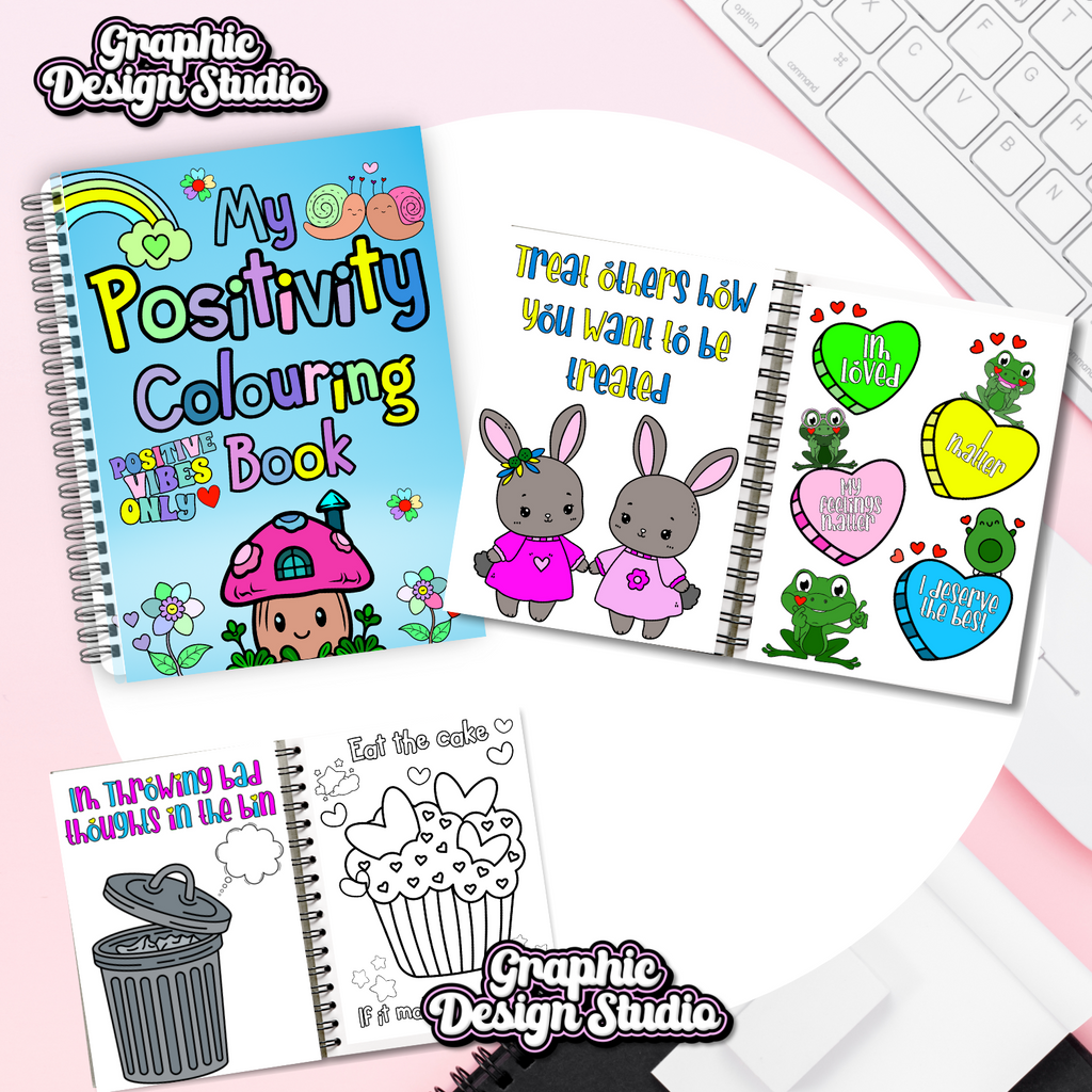 Coloring book with illustrations on a pink surface with keyboard