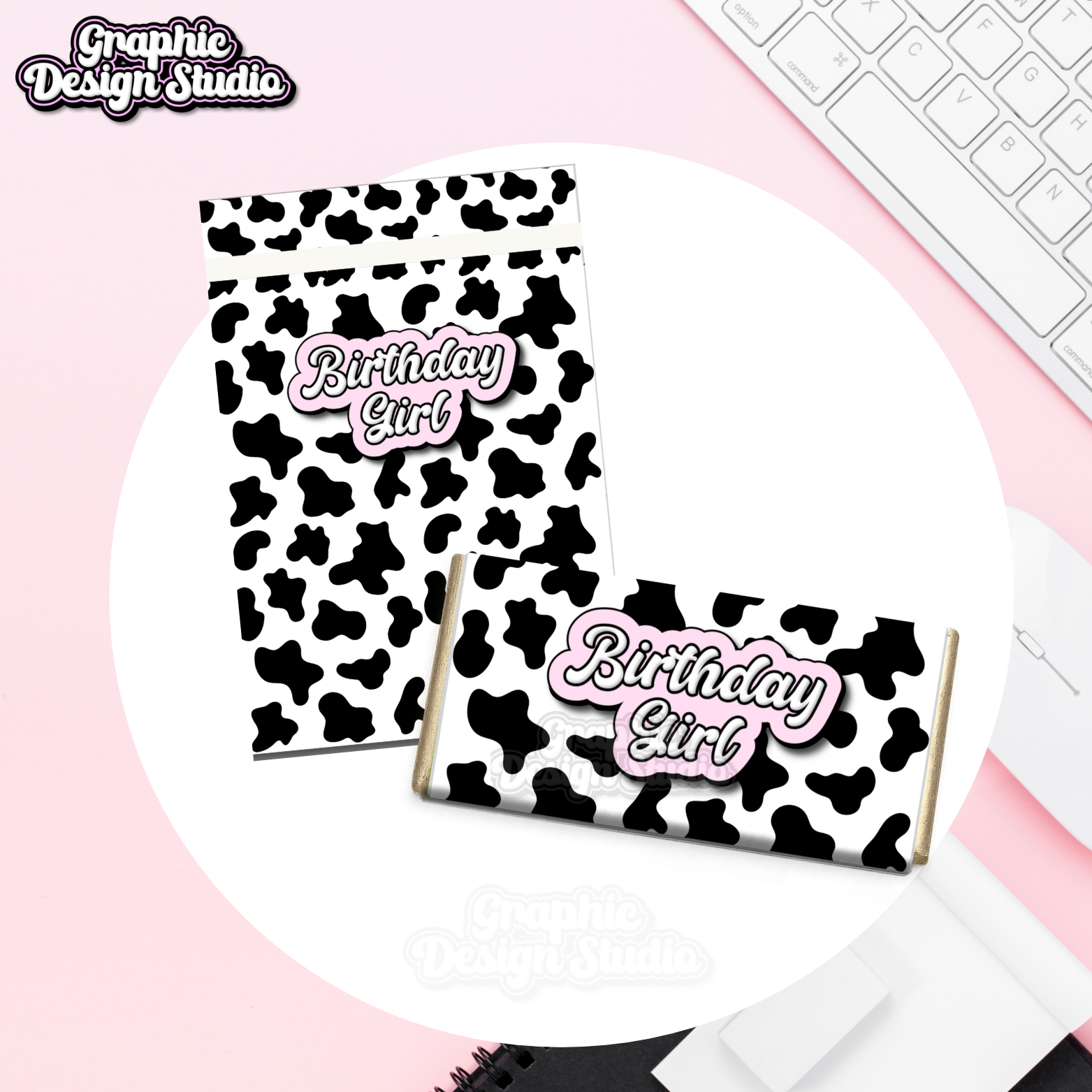 Cow print candy bars with 'Birthday Girl' text on a pink surface