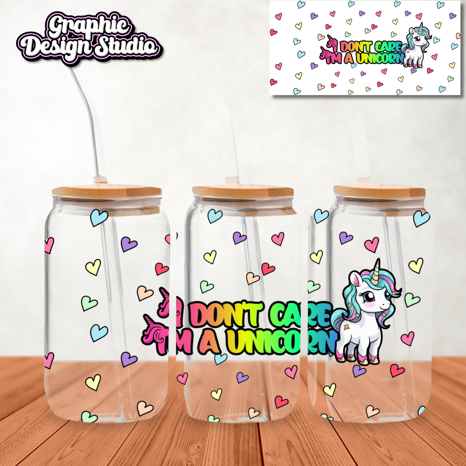 Three glass tumblers with wooden lids on a wooden surface, featuring a unicorn design and text.