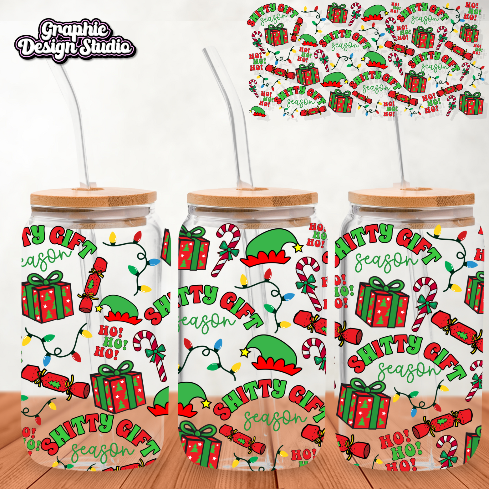 Three Christmas-themed tumblers with festive designs on a wooden surface.