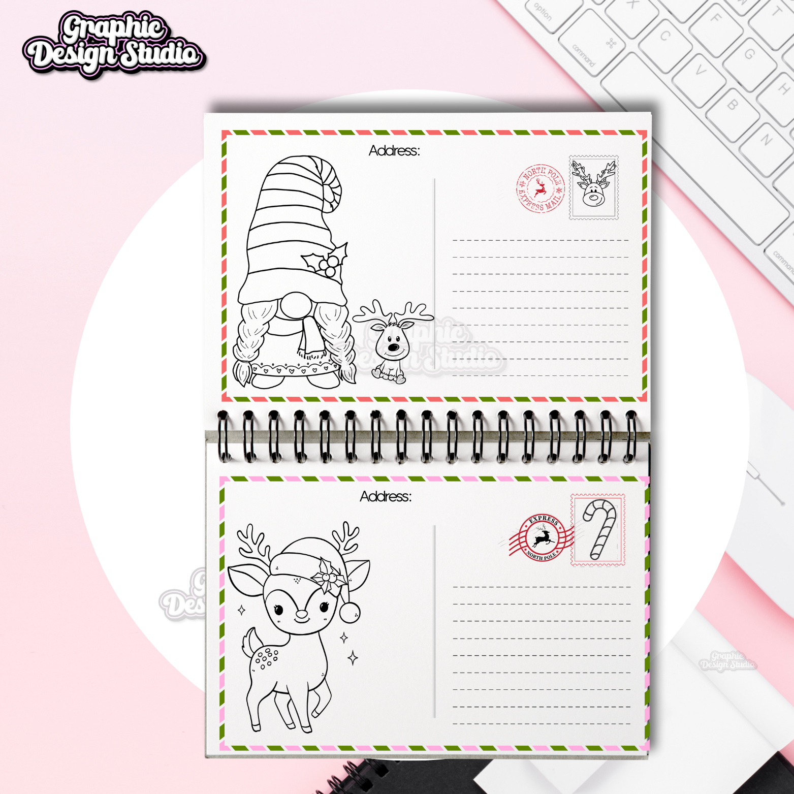 Notebook with Christmas-themed pages on a pink surface with a keyboard.
