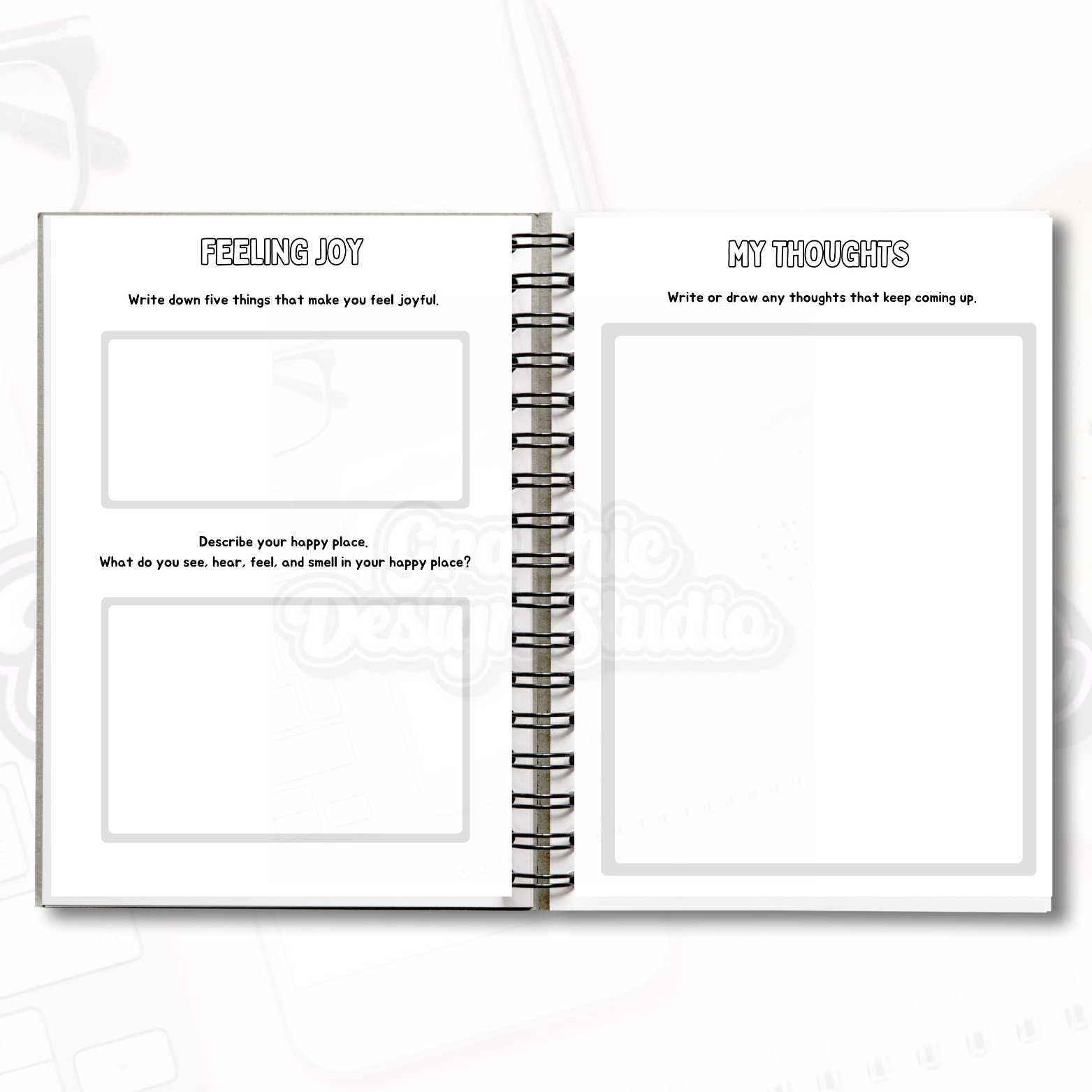 Open spiral-bound notebook with self-help pages on a white background