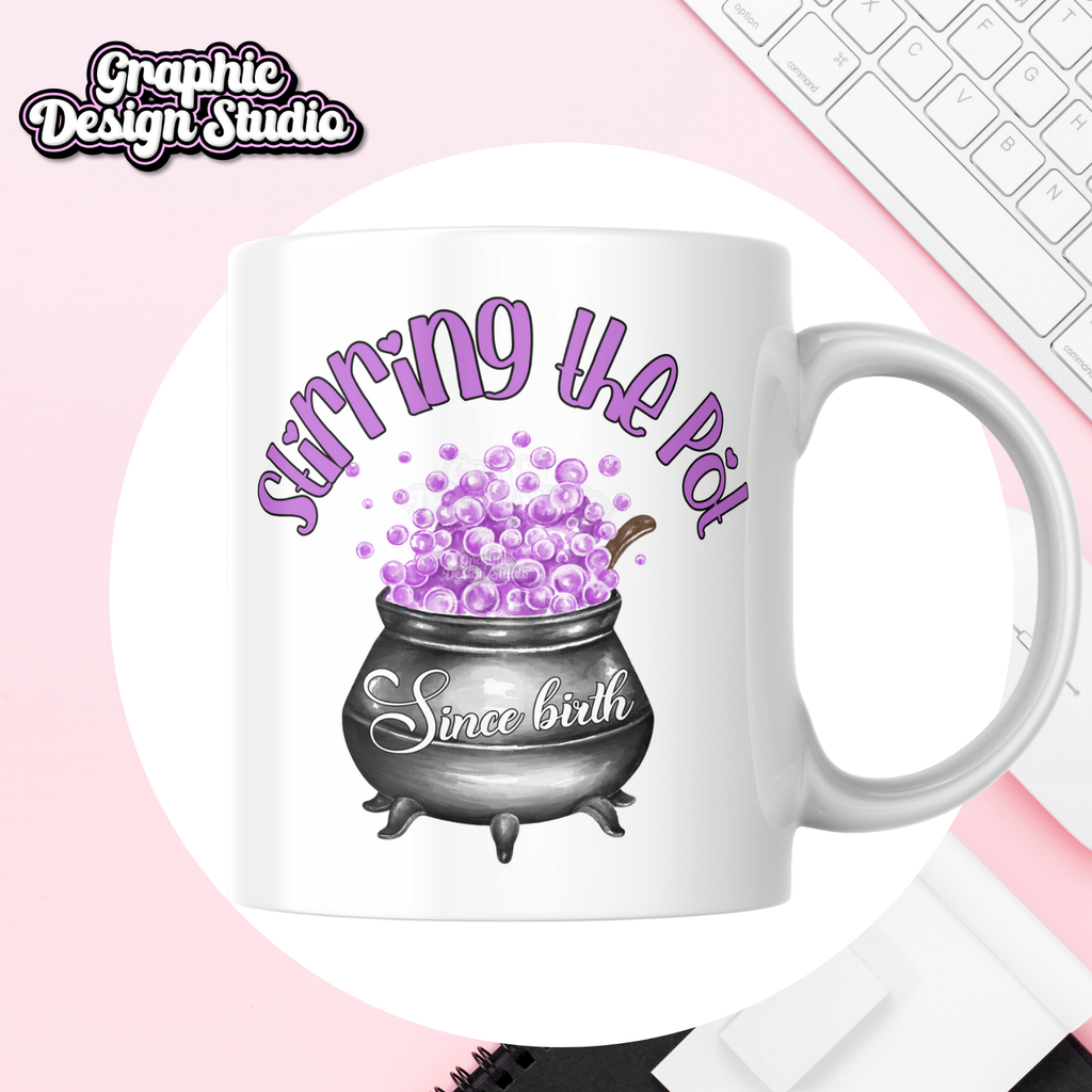 A purple design with a witches pot in the middle,with a quote saying stirring the pot since birth, printed on to a mug mock-up 