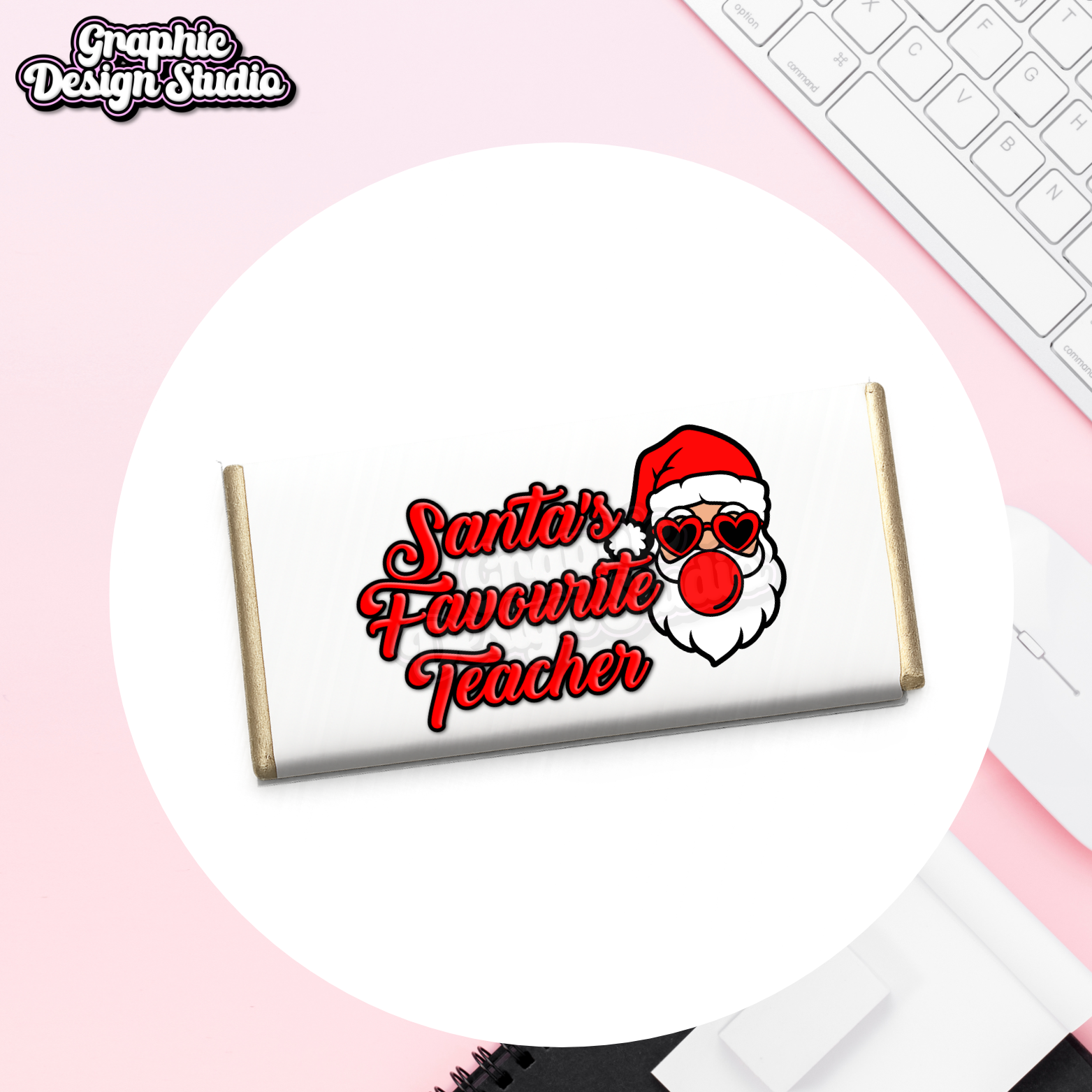 Chocolate bar with 'Santa's Favourite Teacher' text and Santa Claus design on a pink surface.